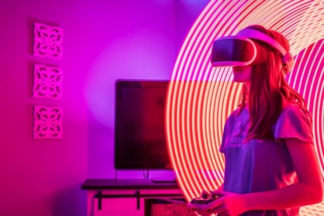 a woman in a virtual reality headset surrounded by colored lighting for neon gaming setup