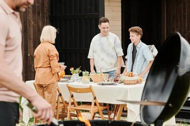 people preparing an outdoor table for a meal for diy outdoor tables