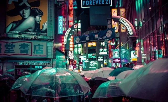 umbrellas at night in a busy street for movies with neon lights umbrellas at night in a busy street for movies with neon lights