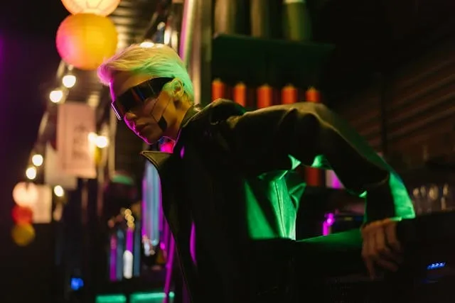 a woman wearing black clothing and sunglasses for movies with neon lights a woman wearing black clothing and sunglasses for movies with neon lights
