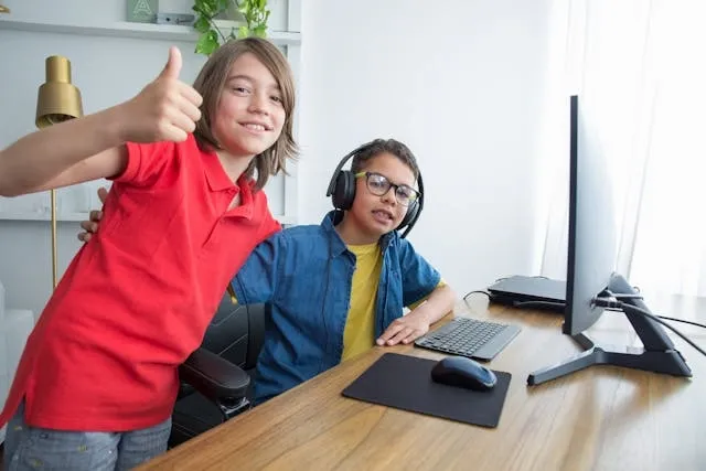 two kids in front of a computer for mouse pad material
