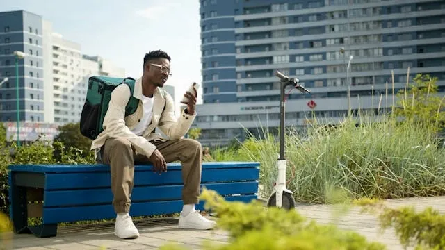 a man with a backpack sitting on a bench for how to wash a backpack a man with a backpack sitting on a bench for how to wash a backpack