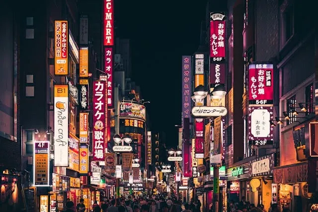 people walking on a neon-filled street for tokyo neon lights people walking on a neon-filled street for tokyo neon lights