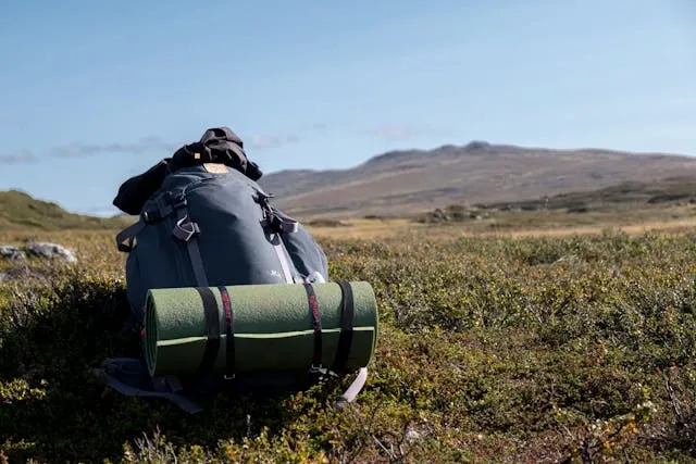 a hiking pack in a field for how much does a backpack weigh a hiking pack in a field for how much does a backpack weigh