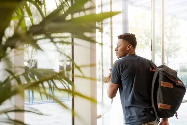 a man carrying a backpack indoors for how much does a backpack weigh a man carrying a backpack indoors for how much does a backpack weigh