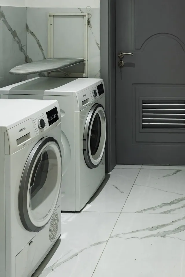 Photograph of washer and dryer in utility room for how to wash polyester tablecloths