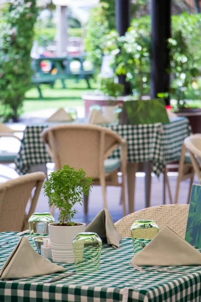 Tables with tablecloths at an outdoor event for how much does it cost to rent tablecloths